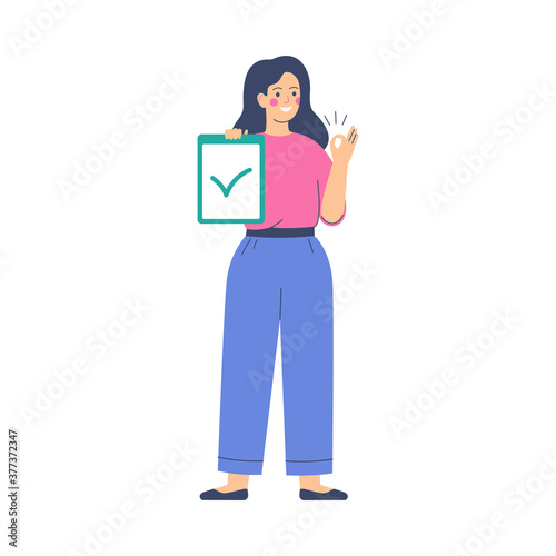 Smiling woman holds a list with a green checkmark and shows a hand gesture ok. Young female character approves and supports something. Vector illustration on white