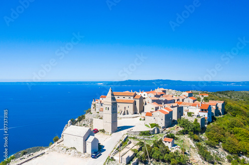 Amazing historic town of Lubenice on the high cliff, Cres island in Croatia, Adriatic sea in background 