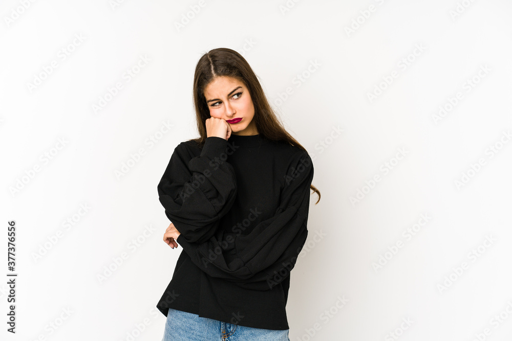 Young caucasian woman isolated on white background who feels sad and pensive, looking at copy space. Young caucasian woman isolated on white background who feels sad and pensive, looking at copy space.