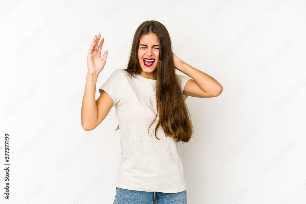Young caucasian woman isolated on white background screaming with rage. Young caucasian woman isolated on white background screaming with rage.