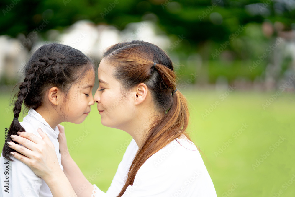 Happy loving family, Mom and daughter playing and kissing, Togetherness concept. Happy loving family, Mom and daughter playing and kissing, Togetherness concept.