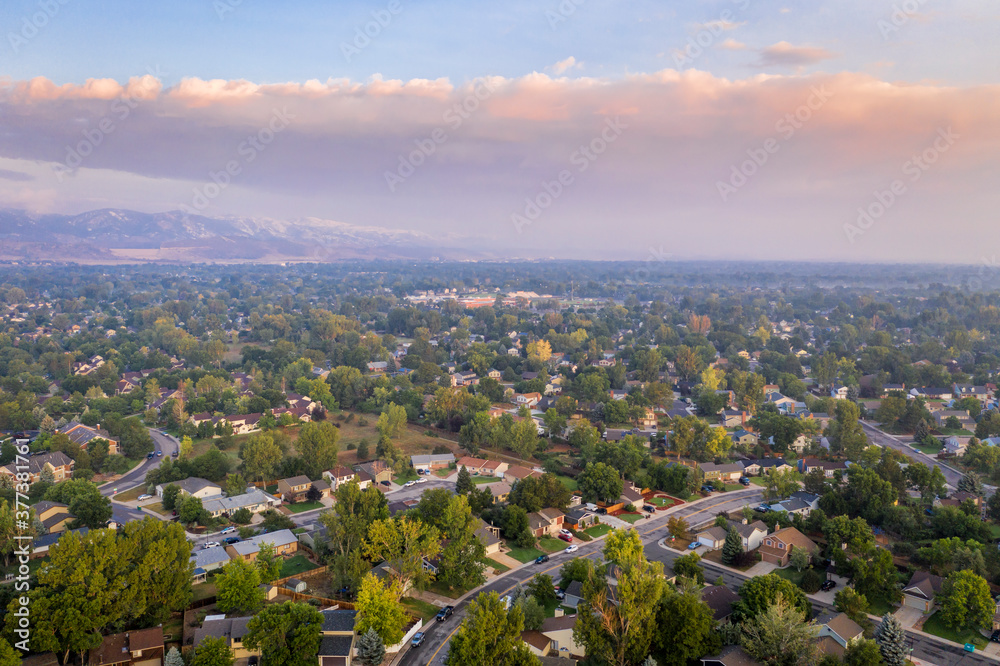 hazy morning with wildfire smoke from Cameron Peak Fire over Fort Collins in northern Colorado, aerial view