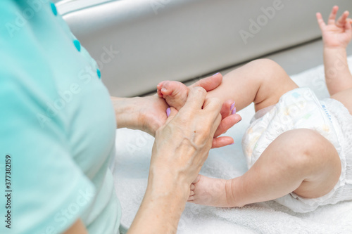 Baby massage closeup. Mother and child. Newborn.
