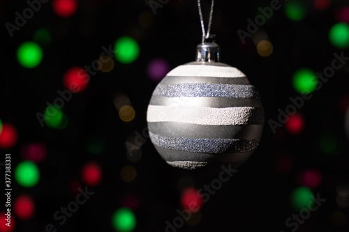 Silver christmas ball on blur background.Bokeh background