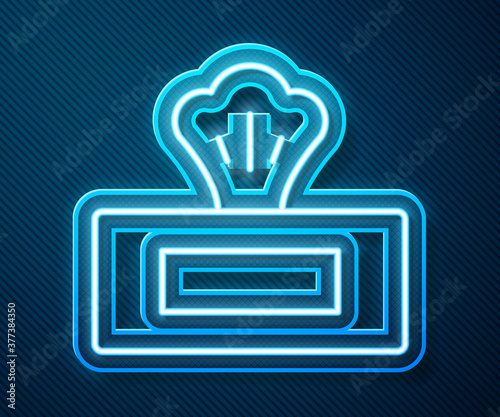 Glowing neon line Wet wipe pack icon isolated on blue background. Vector.