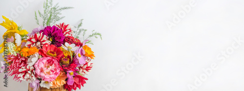 Background banner with colorful beautiful floral bouquet with copy space on a white background. © Victoria