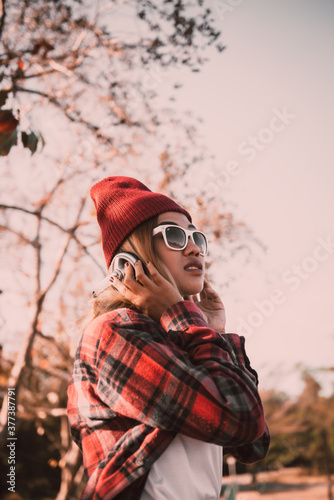 Portrait of asian hipster girl wear orange sunglass vintage style