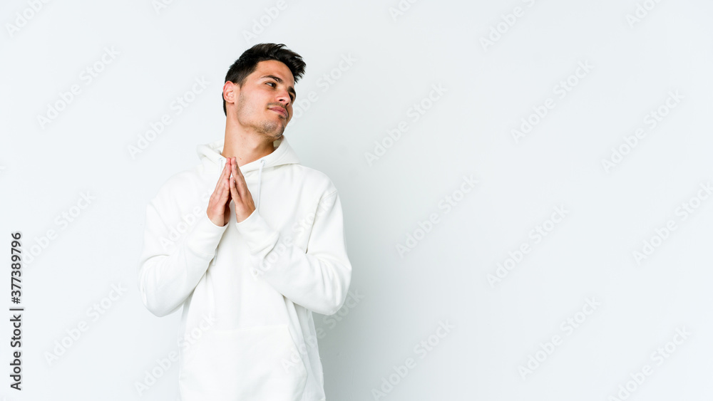 Young caucasian man isolated on white background making up plan in mind, setting up an idea. Young caucasian man isolated on white background making up plan in mind, setting up an idea.