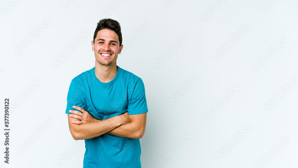 Fototapeta premium Young caucasian man isolated on white background laughing and having fun.