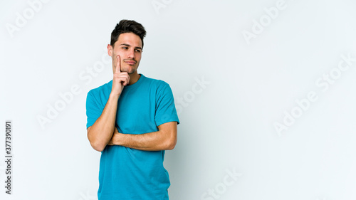 Young caucasian man isolated on white background contemplating, planning a strategy, thinking about the way of a business.
