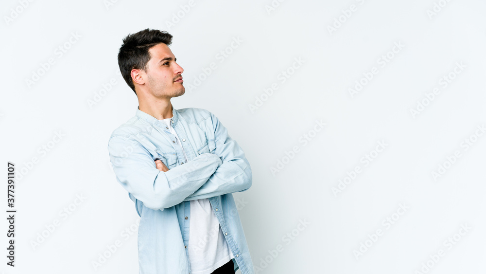 Young caucasian man isolated on white background dreaming of achieving goals and purposes Young caucasian man isolated on white background dreaming of achieving goals and purposes