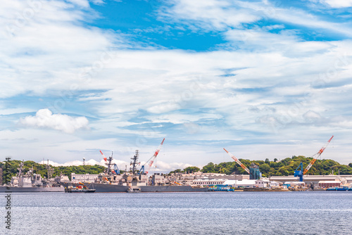 yokosuka, japan - july 19 2020: American Arleigh Burke-class destroyer USS John S. McCain DDG-56 and USS Curtis Wilbur DDG-54 of the United States Navy berthed in the Japanese Yokosuka naval base. photo