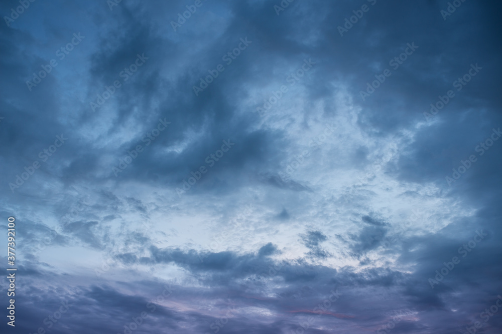 Dramatic dark blue sky with heavy clouds background