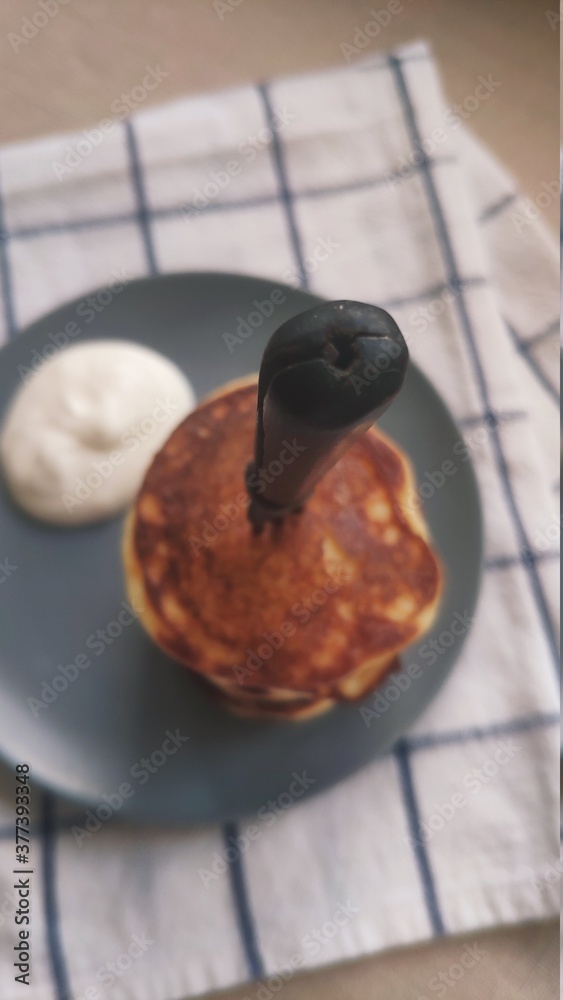 Fototapeta premium Plate with stack of pancakes and vintage fork, selective focus