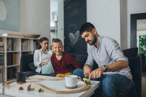 cute young family spending time together at home