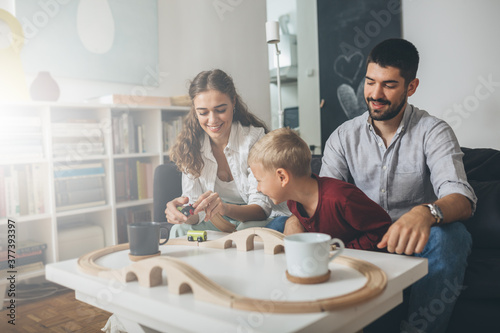 cute young family spending time together at home