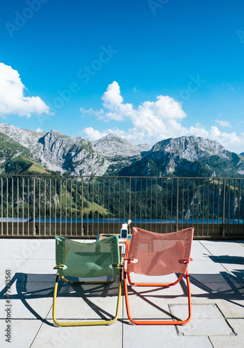 Two sun chairs with a view of the alps