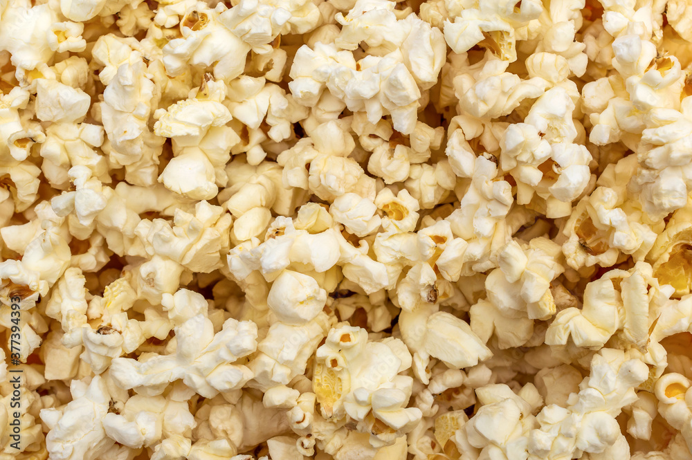 Popcorn background. Scattered popcorn. Close up. Abstract background.