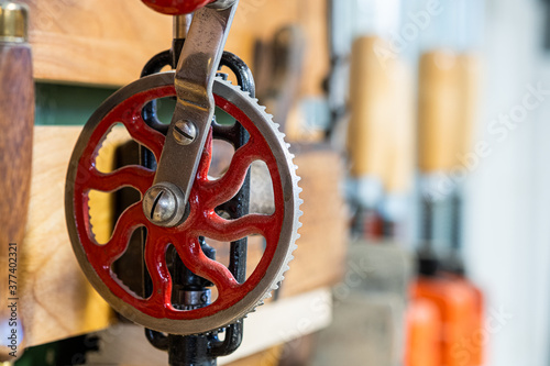 Konstfotografi Vintage hand drill hanging on a tool rack