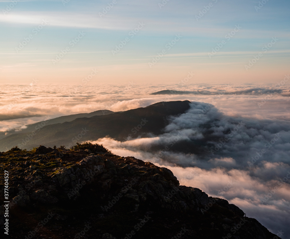 Little Bigelow Mountain at sunrise rising above the morning mist Little Bigelow Mountain at sunrise rising above the morning mist