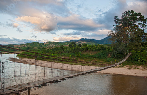 sketchy suspension footbridge in rural area of Vietnam