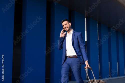 Businessman with suitcase taking a business trip