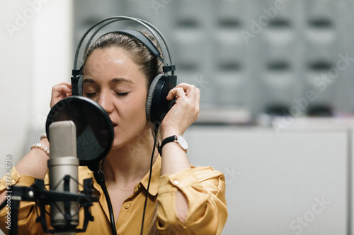 Two women singing at sutdio photo