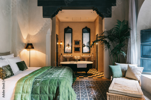 Master Bedroom With Attached Bathroom and Bathtub