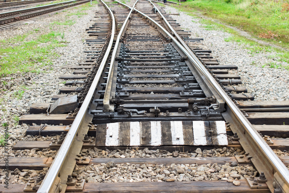 Rail tracks with rail sleepers at the railway pointwork. Change of direction. Railway arrows with rail track elements. Rail tracks with rail sleepers at the railway pointwork. Change of direction. Railway arrows with rail track elements.