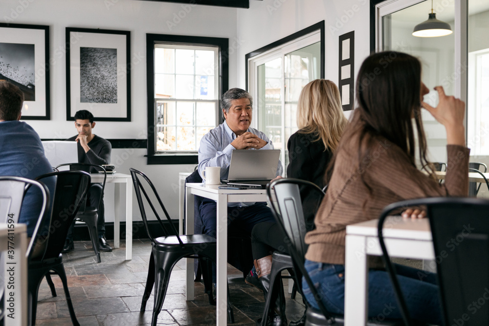Business: Man And Woman Meeting For Business In Cafe Business: Man And Woman Meeting For Business In Cafe