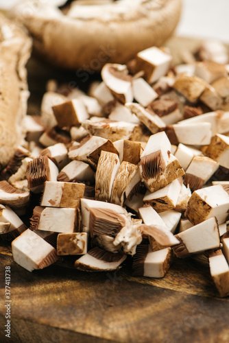 Chopped portabello mushrooms on a wooden cutting board photo