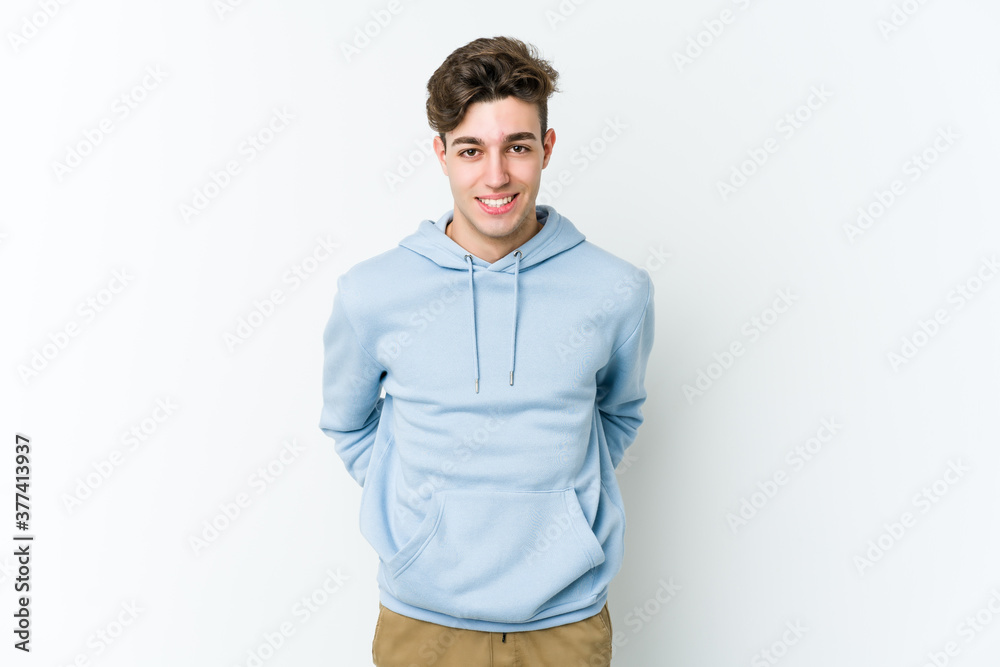 Fototapeta premium Young caucasian man isolated on white background happy, smiling and cheerful.