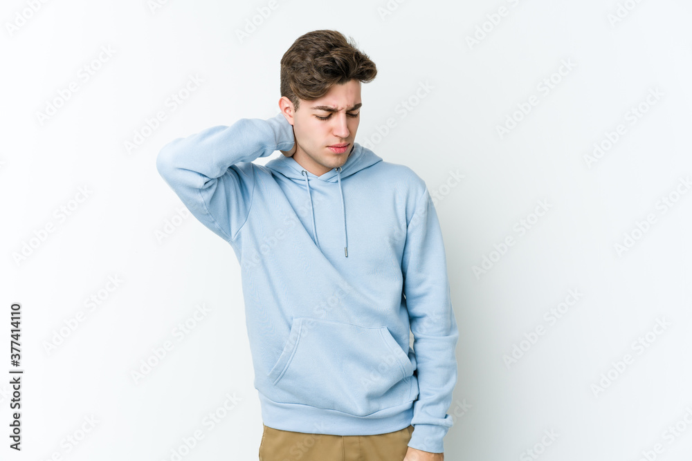 Young caucasian man isolated on white background suffering neck pain due to sedentary lifestyle. Young caucasian man isolated on white background suffering neck pain due to sedentary lifestyle.