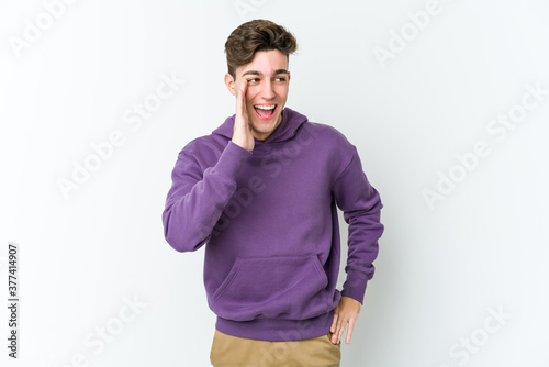Young caucasian man isolated on white background shouting excited to front.