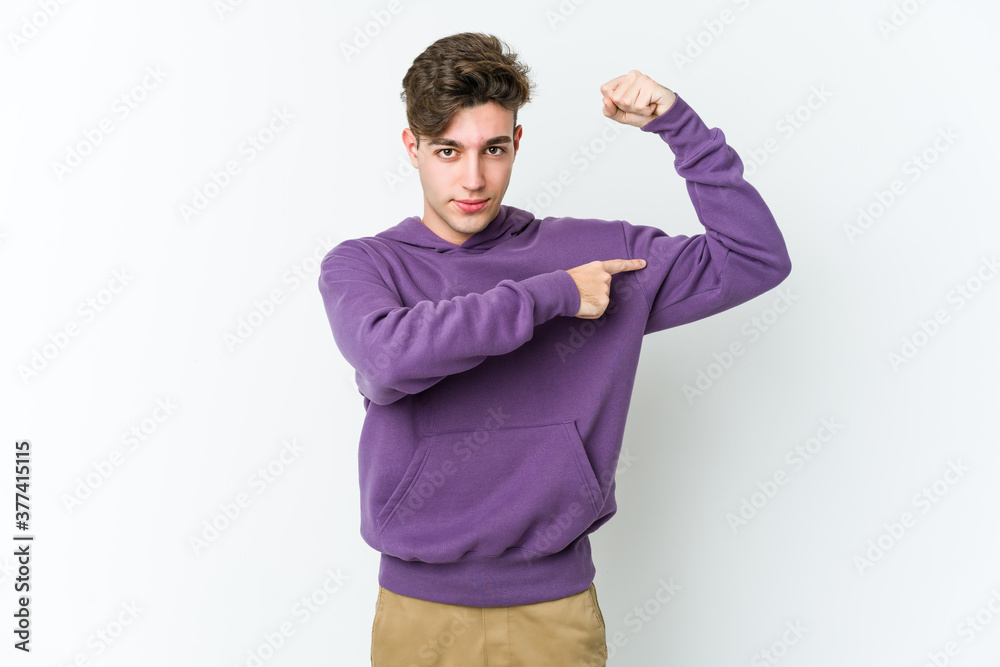 Young caucasian man isolated on white background showing strength gesture with arms, symbol of feminine power Young caucasian man isolated on white background showing strength gesture with arms, symbol of feminine power