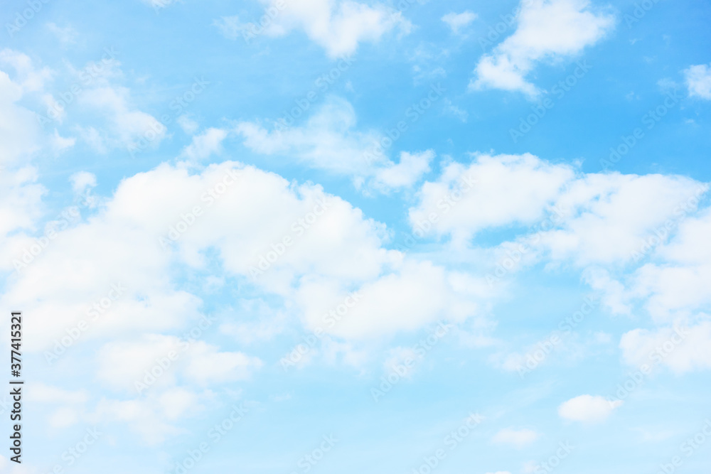Light pastel blue sky with white clouds Light pastel blue sky with white clouds