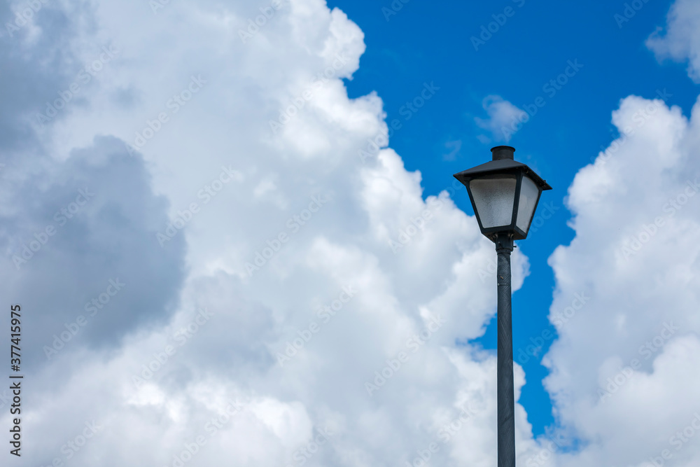 Lamppost Against Cloudy Sky With Copy Space