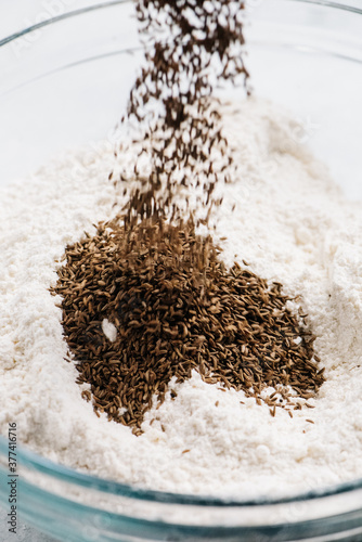 Adding caraway seeds to dry mix photo