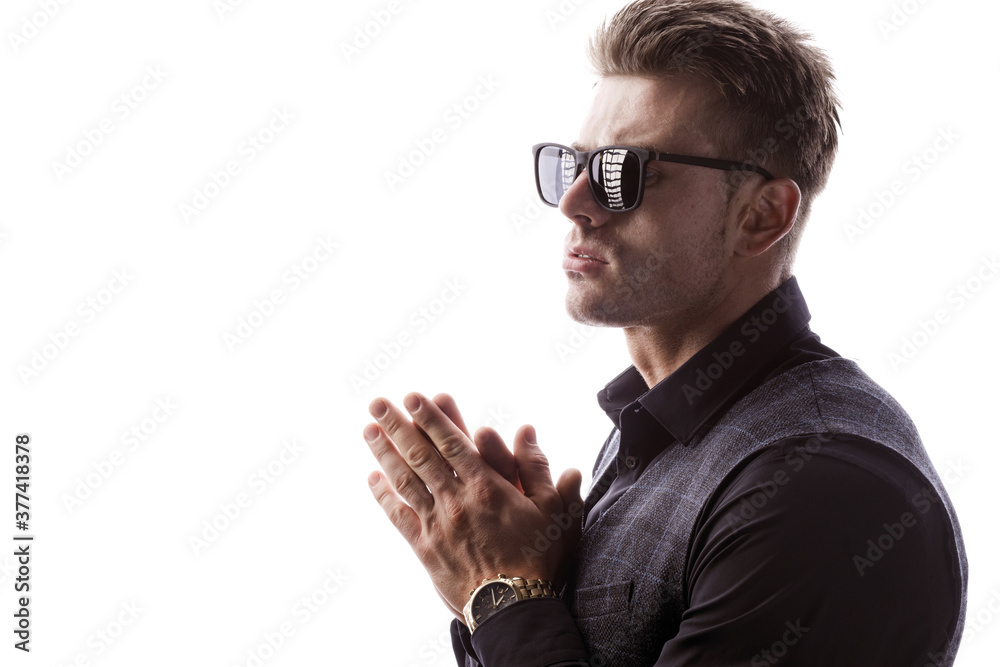 Portrait of beautyful guy on white background. High fashion model posing in studio. Attractive man in classic suit and sunglasses. Portrait of beautyful guy on white background. High fashion model posing in studio. Attractive man in classic suit and sunglasses.