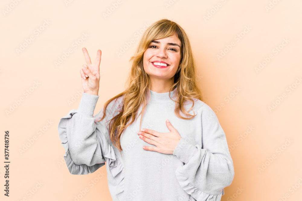 Young blonde caucasian woman taking an oath, putting hand on chest. Young blonde caucasian woman taking an oath, putting hand on chest.