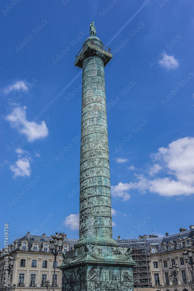 Vendome column with statue of Napoleon Bonaparte, on the Place Vendome in Paris, France. Vendome column has 425 spiraling bas-relief bronze plates were made out of cannon.