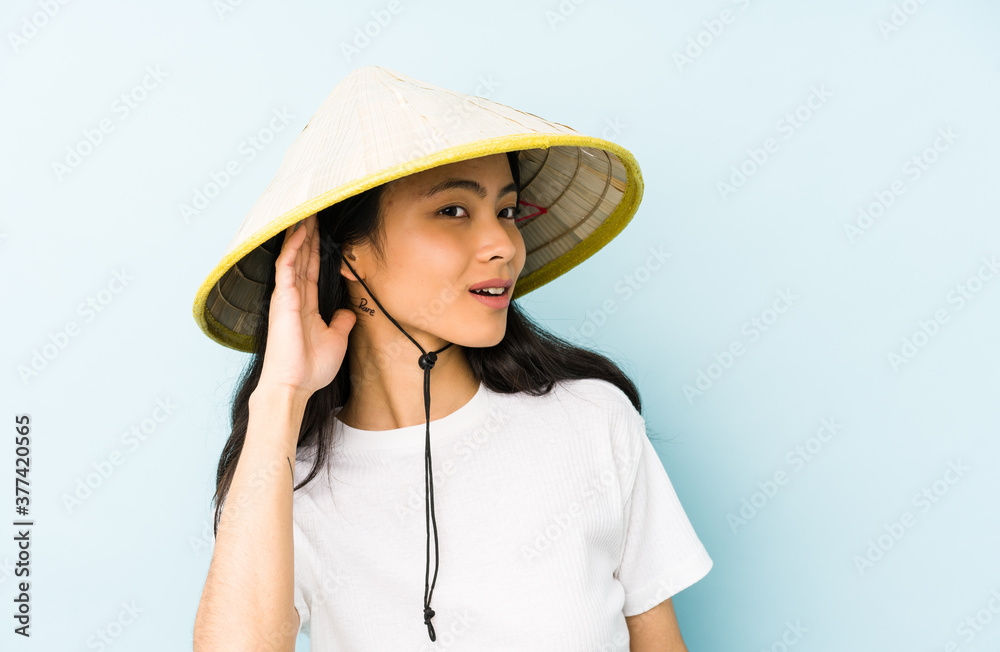 Young chinese woman wearing a vietnamese hay isolated being shocked, she has remembered important meeting. Young chinese woman wearing a vietnamese hay isolated being shocked, she has remembered important meeting.