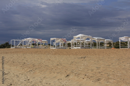 beach with umbrellas and chairs