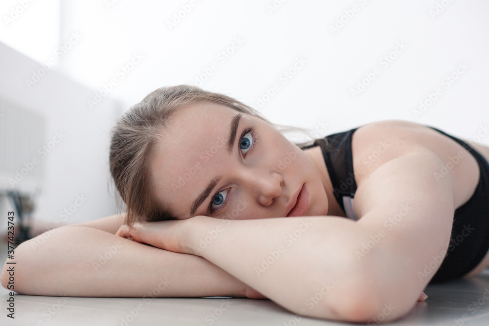 Portraits of beautiful young gymnast woman posing in stretching classes studio Portraits of beautiful young gymnast woman posing in stretching classes studio