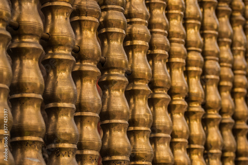 Texture of a gold metal old fence on the island of Sri Lanka, golden background