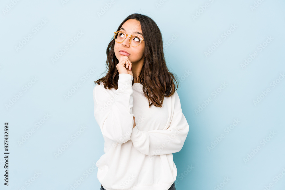 Young mixed race hispanic woman isolated looking sideways with doubtful and skeptical expression. Young mixed race hispanic woman isolated looking sideways with doubtful and skeptical expression.