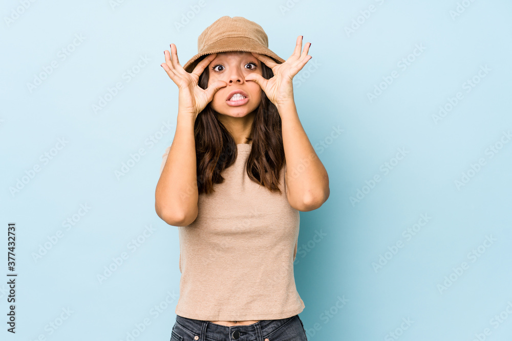 Young mixed race hispanic woman isolated keeping eyes opened to find a success opportunity. Young mixed race hispanic woman isolated keeping eyes opened to find a success opportunity.