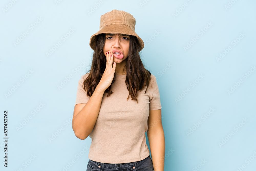 Young mixed race hispanic woman isolated having a strong teeth pain, molar ache. Young mixed race hispanic woman isolated having a strong teeth pain, molar ache.