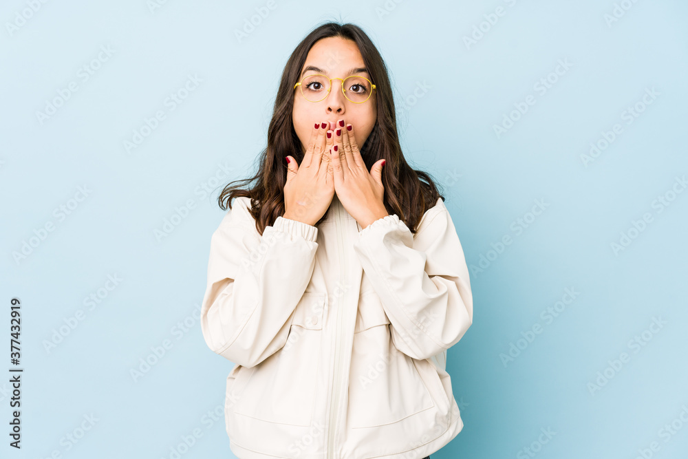 Young mixed race hispanic woman isolated shocked covering mouth with hands. Young mixed race hispanic woman isolated shocked covering mouth with hands.