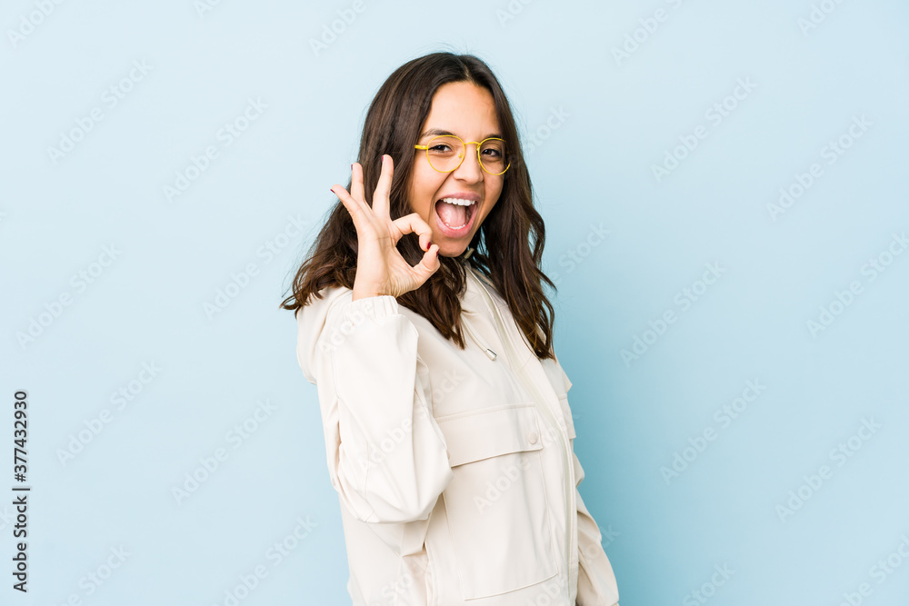 Young mixed race hispanic woman isolated cheerful and confident showing ok gesture. Young mixed race hispanic woman isolated cheerful and confident showing ok gesture.